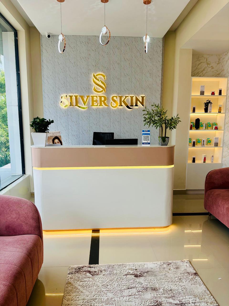 Silver Skin Clinic reception desk and illuminated brand wall